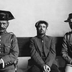 Murder Suspect with Spanish Policemen